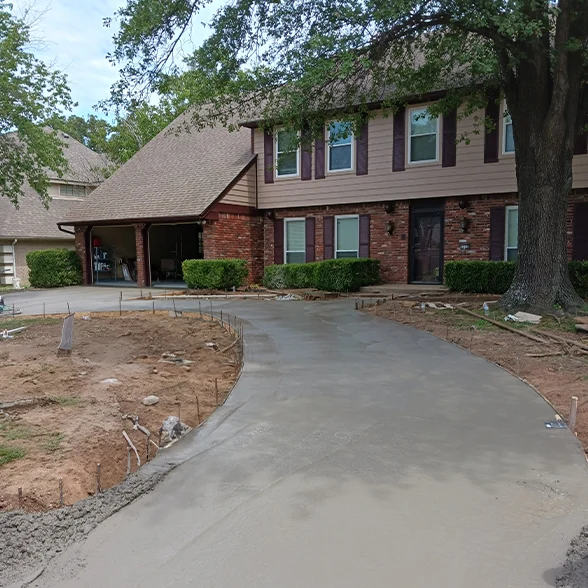 Residential Concrete Tulsa - Curved concrete driveway installation with forms by Alexis Construction