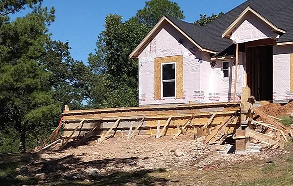 Wood forming for a raised residential concrete Tulsa foundation on a slope